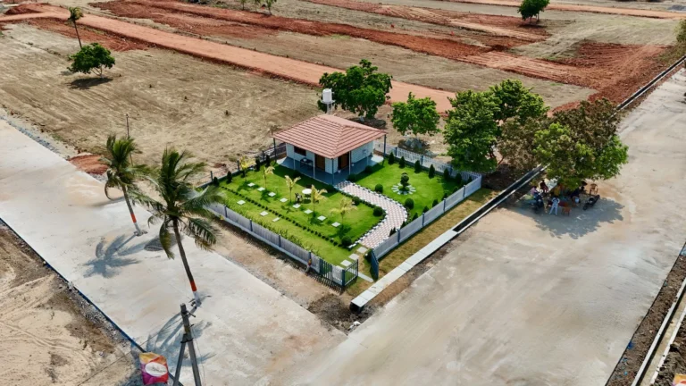 Aerial view of Motherland Sunrise City Atmakur plotted community with clubhouse and landscaped open space